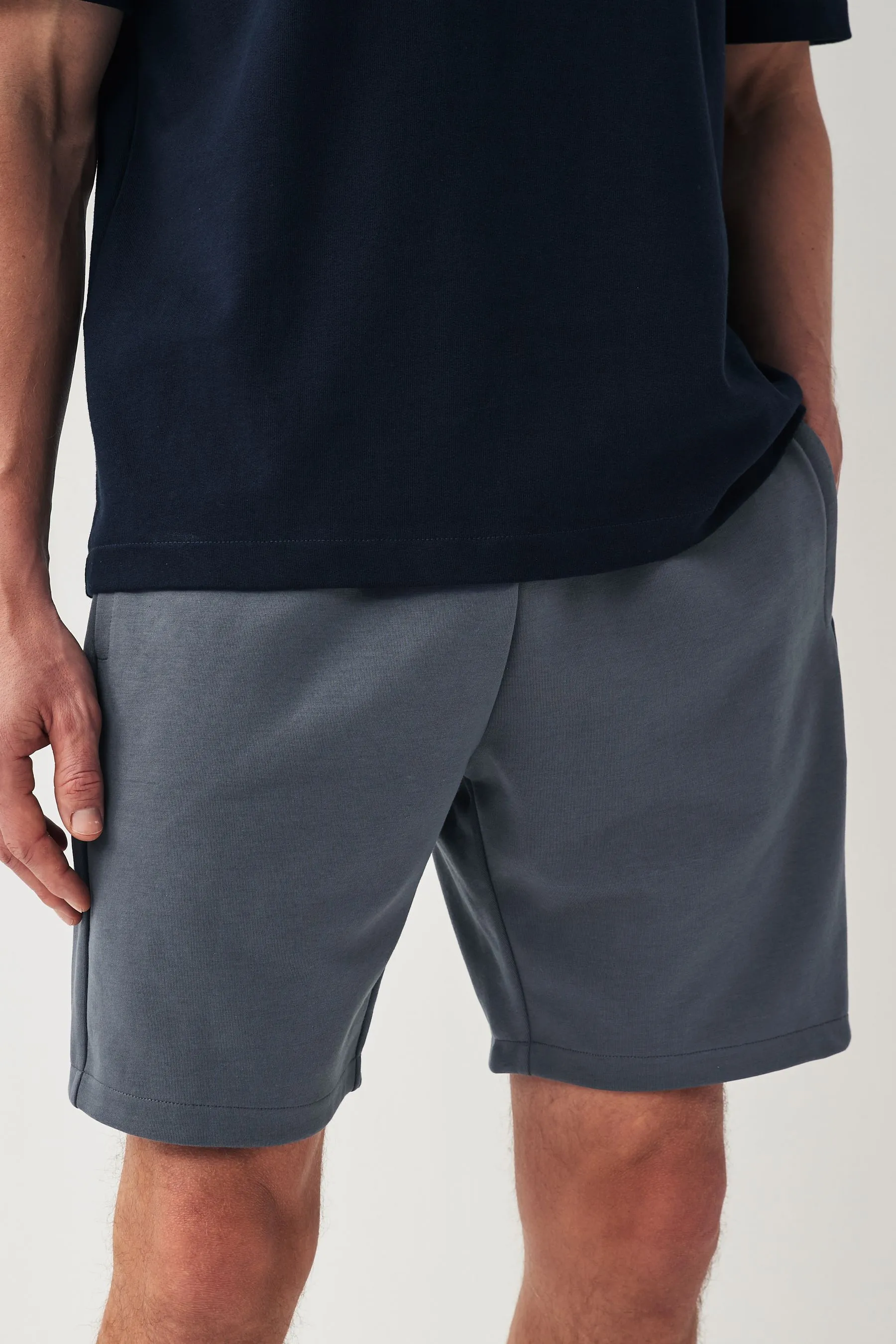 Shorts in jersey con tasche con zip