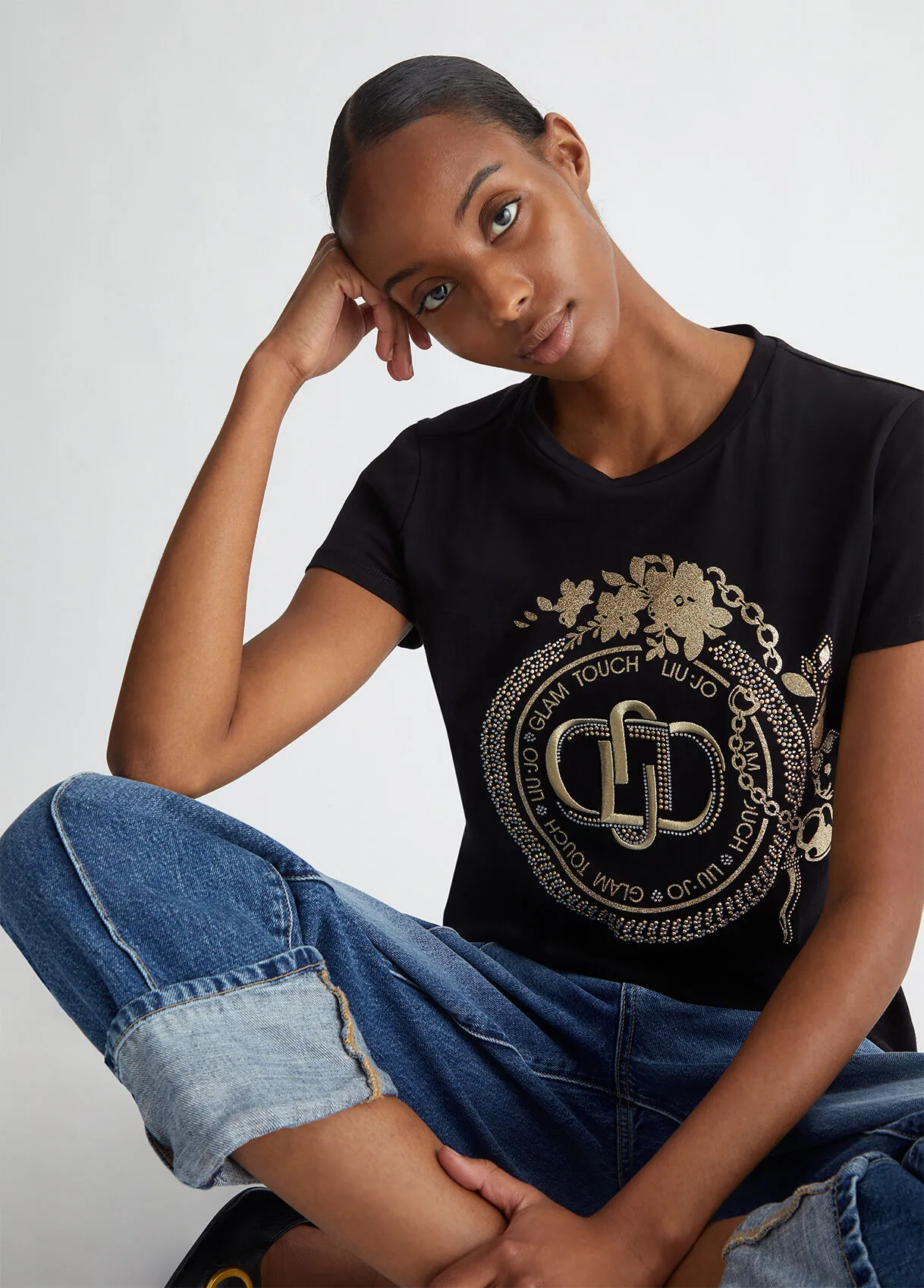 T-shirt con logo e strass
